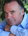 joseph culliton_headshot_blue shirt_crossed arms